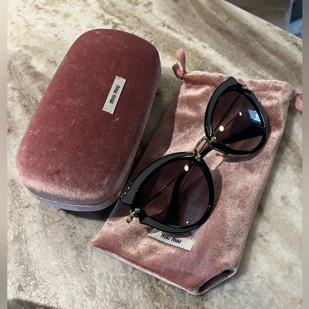Miu Miu black cat eye sunglasses with textured detailing
